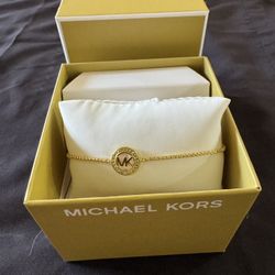 MK Bracelet Beautiful Michael Kors gold-tone adjustable bracelet. Features the classic MK logo charm