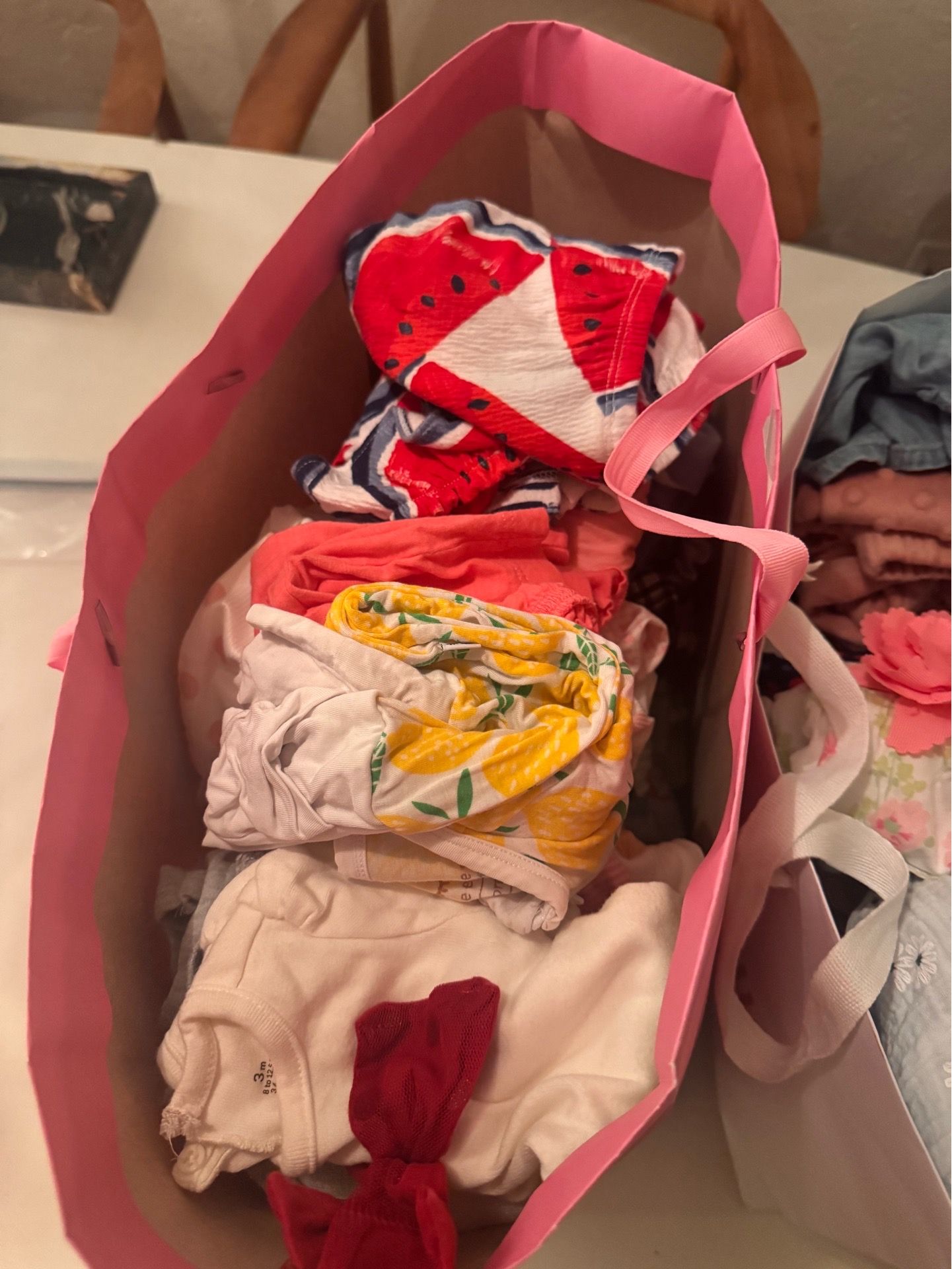 2 big bags of laundered baby girl clothes