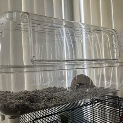 hamster cage with a coconut hiding space
