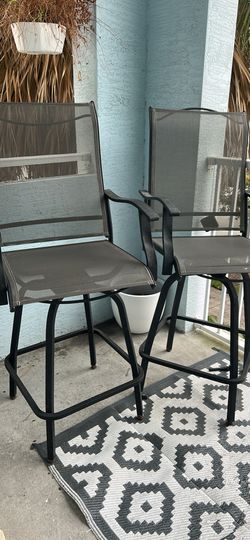 2 outdoor swivel chairs