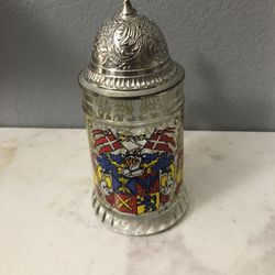 Etched Glass Beer Stein Coat of Arms.  Size 14 ounces.  Germany with a Pewter lid.  Preowned excellent condition. Has been on display in a cabinet.  S