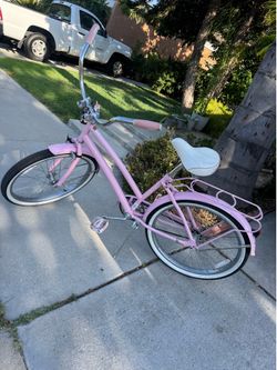 Pink Woman’s Huffy beach cruiser