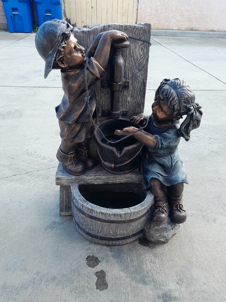 25.5 in. H Polyresin Boy and Girl Sculptural Outdoor Fountain with Pump and LED Lights
