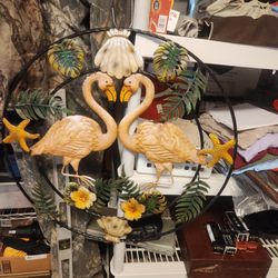 Vintage metal kissing flamingos