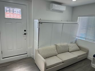 Queen Murphy bed and mattress . Mattress used last month hand fool of times