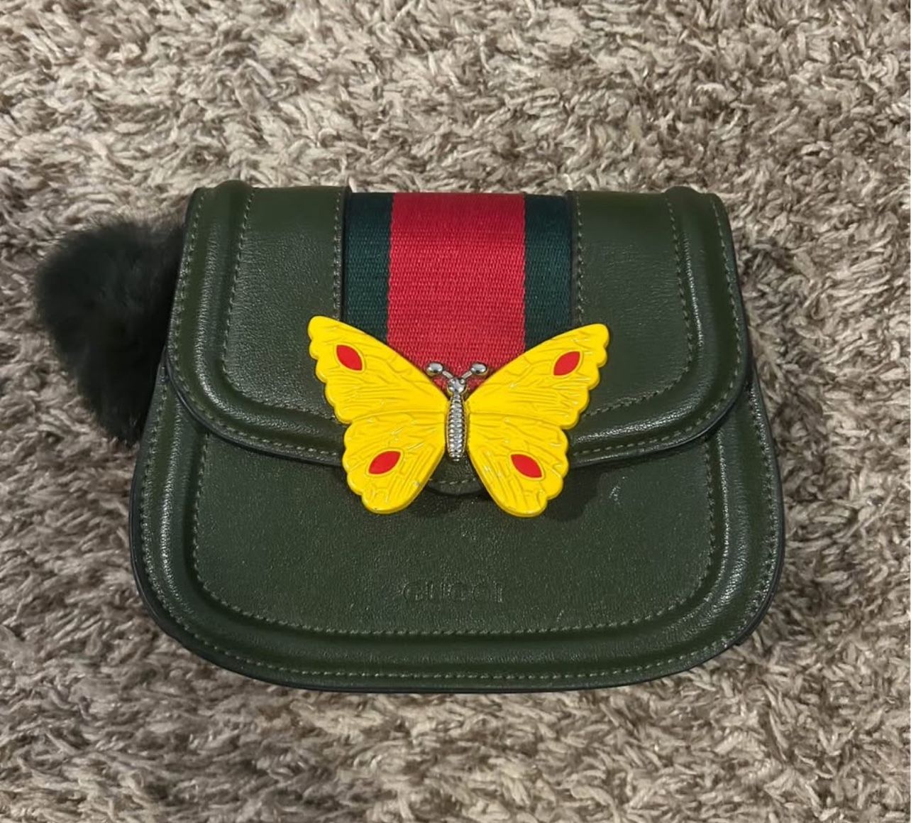 Green gucci purse with yellow butterfly detail
