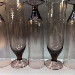Set of (8) Gorgeous swirl tall champagne glasses. Amethyst Purple Hand blown delicate design with swirl glass bowls. Excellent condition.