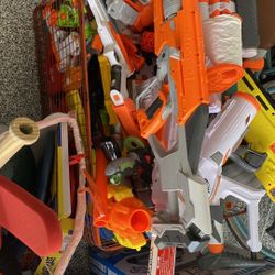 Approximately 50 Nerf Guns 