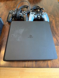 PlayStation 4 Slim with controllers and all cables.