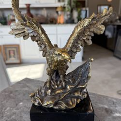 A Bronze-Finished Resin Eagle Sculpture on Black Base