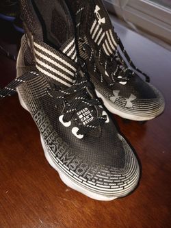 Under Armors kids football cleats