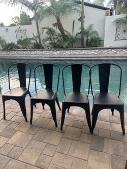four metal chairs
