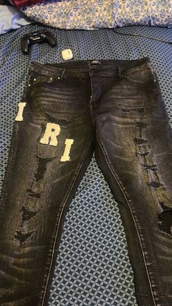 Amiri Distressed Black Jeans with Varsity Patches