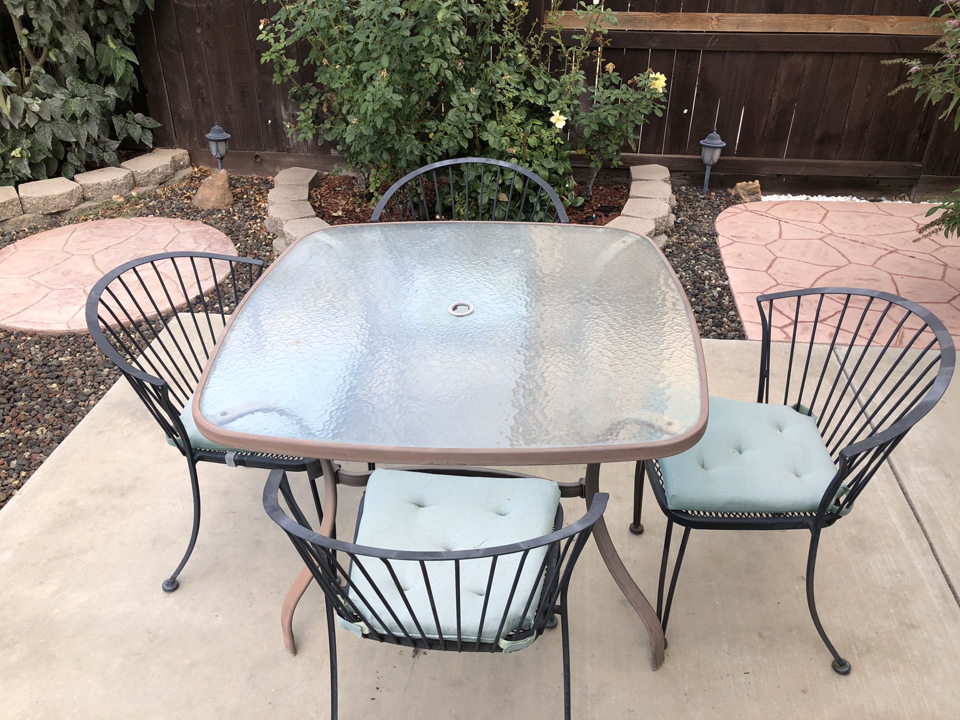 Glass top patio table and chairs.