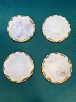Very pretty natural marble stone hexagon shaped coasters with gold leaf edges in a set of 4.
