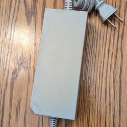 Original Nintendo power supply adapter.