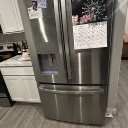 Used GE Stainless Steel Double Door Bottom Freezer