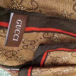 GUCCI  SILK  SCARF GG ICONIC GUCCI LOGO W/RED BLACK STRIPE  XLONG PRE-OWNED NO ISSUES GREAT CONDITION. YES STILL AVAILABLE 75060 AREA  SILK BROWN.