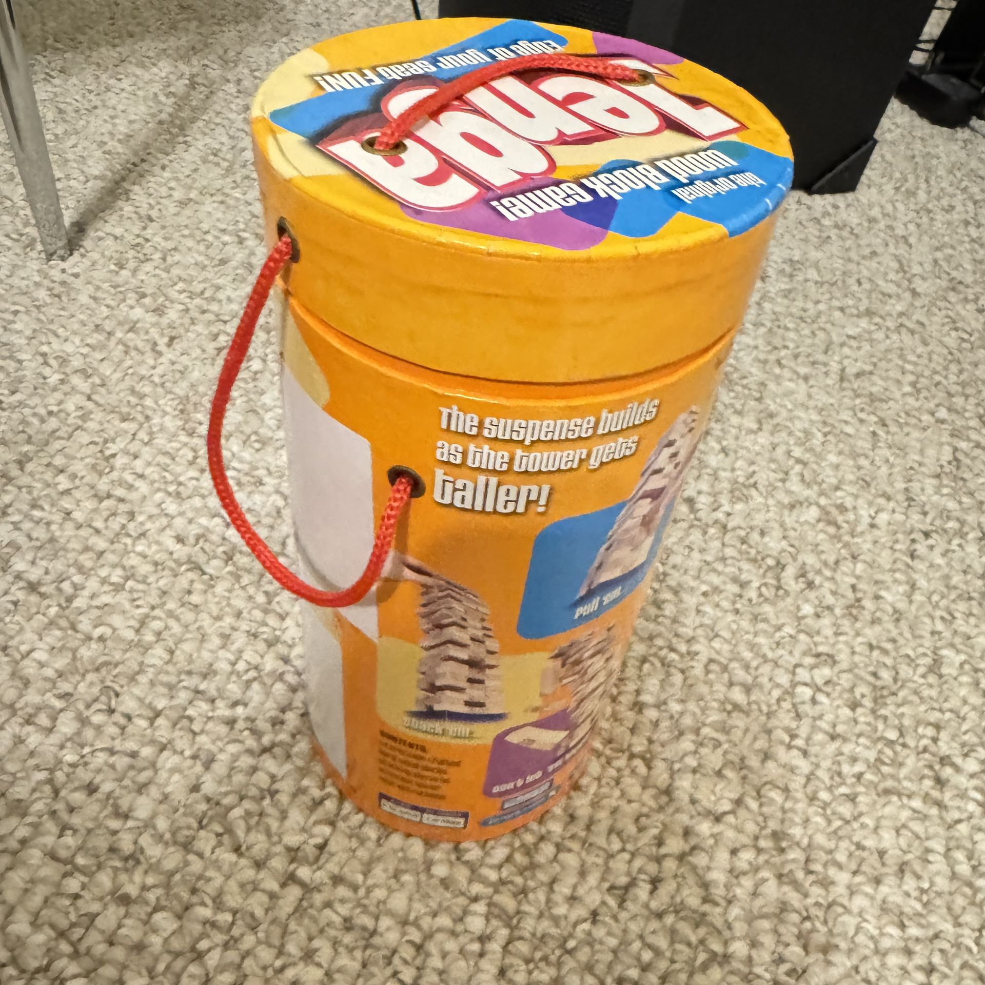 Classic Jenga block game in original packaging. 2 blocks are missing