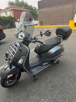 Vespa GTS Scooter with Windshield and Top Case