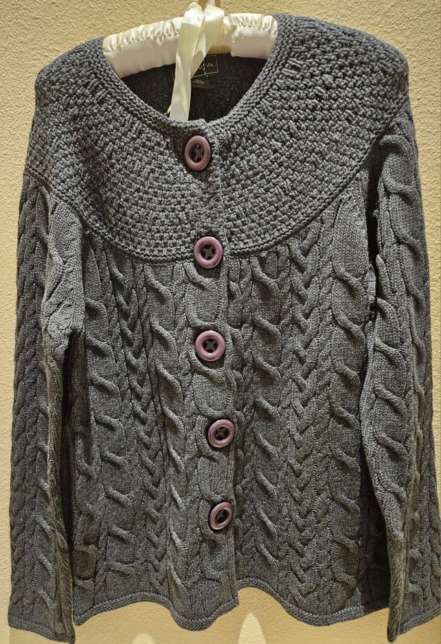 Women's Aran knit cardigan sweater featuring traditional cable Stiching Size M