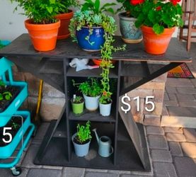 $15 black plant stand table or $20 black rolling cart plant carrier