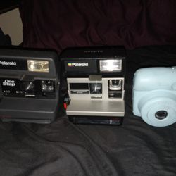 3  Polaroid Cameras