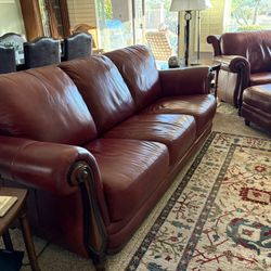 Basset red leather sofa and matching chair and ottoman