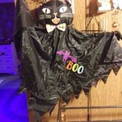 Halloween decorations. Hanging cat, moving ghost, metal haunted house