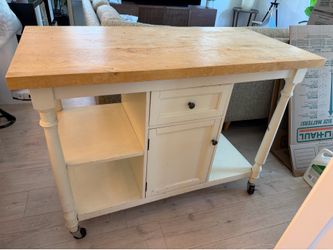 off-white farmhouse-style rolling kitchen island cart