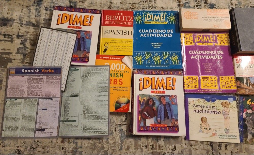 Spanish lesson books, worksheets, dictionaries, laminated reference guides, children's books.