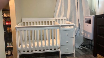 White Baby Crib with Attached Changing Table