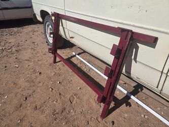Landscaping trailer lockable tool rack