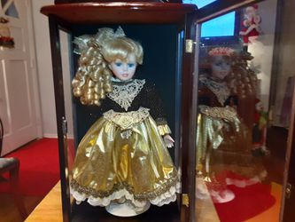 Beautiful DOLL SHE is in a DK BROWN CABINET with Glass FRONT and SIDES MUST see
