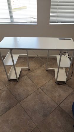 White modern desk with built in charging station and storage shelves