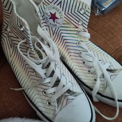 This is a Converse Chuck Taylor All Star High Metallic Exploding Star sneaker in white with a metallic rainbow geometric pattern. Women's! Size 10