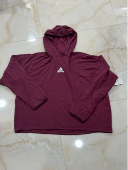 Adidas Women's Youforyou Hoodie in Victory Crimson is a comfortable, roomy top designed for fitness and casual wear.