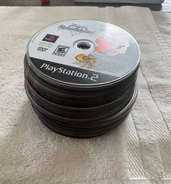 Stack of ps2 and ps3 video games