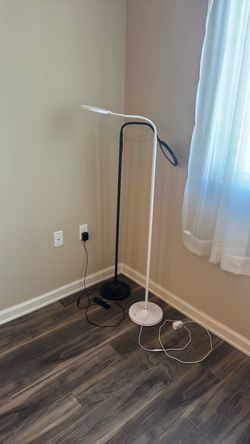Black and white reading lamp. One with remote