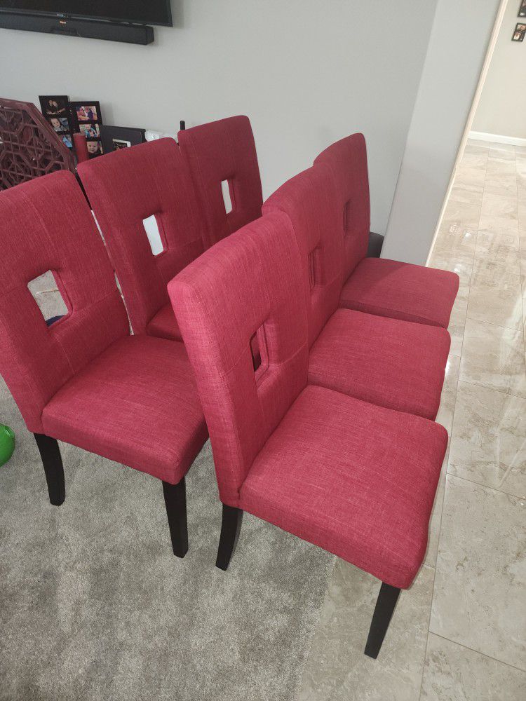 6 Red Cloth Dining Chairs 200.00