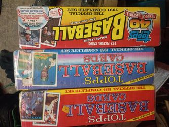 The image displays a collection of vintage Topps baseball card factory-sealed sets from the late 1980s and early 1990s, specifically including complet