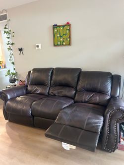 Dark brown leather reclining sofa