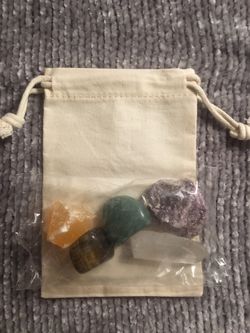 muslin drawstring bag. Includes Quartz Crystal Point, Aventurine, Tiger's Eye, Orange Calcite, & Lepidolite