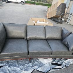 new dark grey leather 2 piece sectional.Beautiful