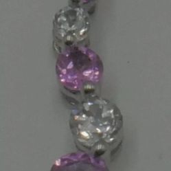10KT WHITE GOLD PENDANT WITH WHITE AND PINK STONES 0.7 GRAMS MINT CONDITION. 858742-10.