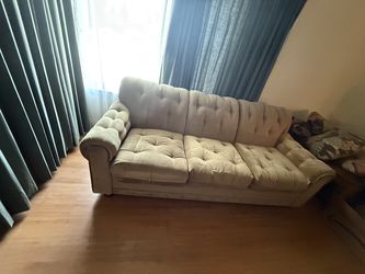 Tan button tufted fabric sofa