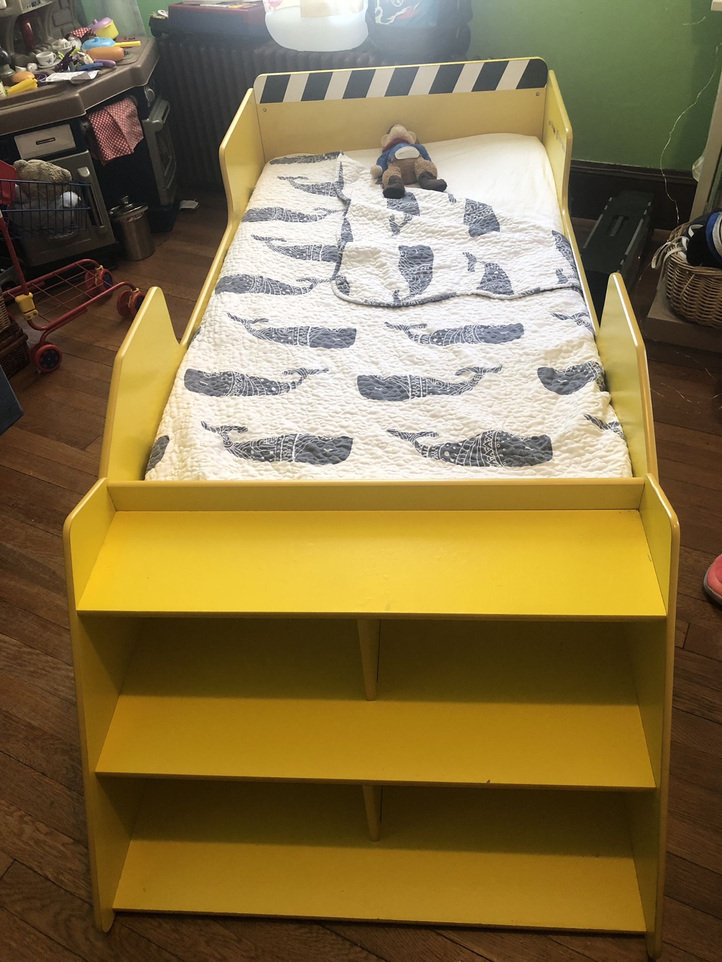 Childs Truck bed with front bookshelf and linens.