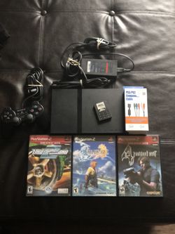 Ps2 with controller, cords, memory card, and games