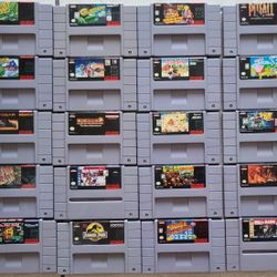 Super Nintendo (SNES) games lot of 20 with 2 controllers.