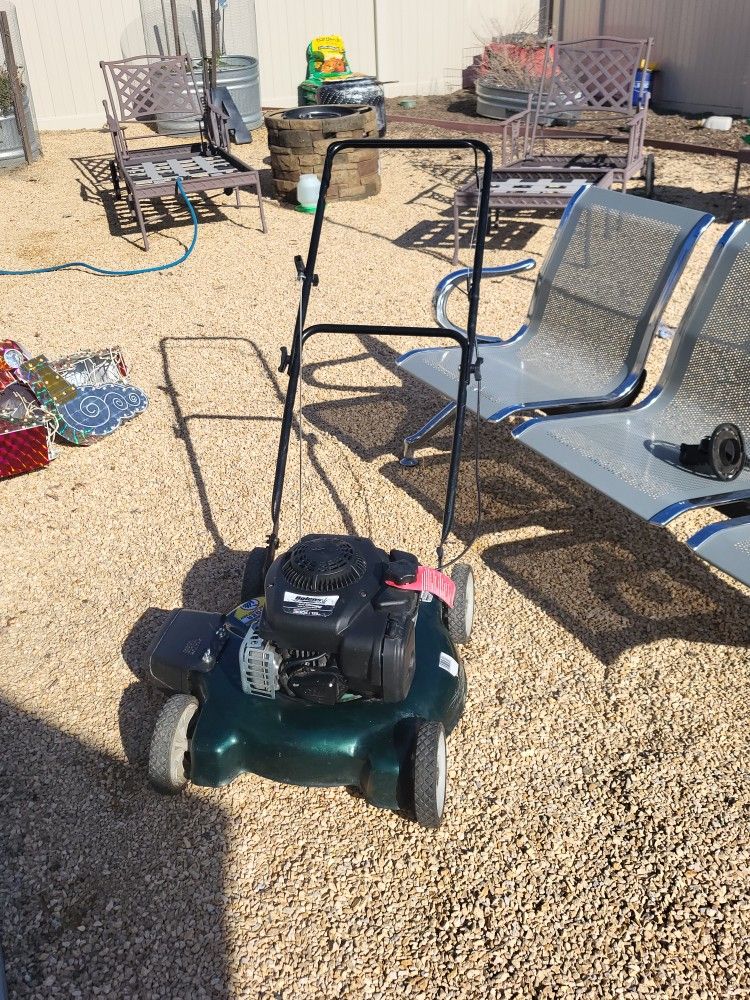 Fairly new sidemount rotary lawn mower. No grass catcher weed whacker. Armo your grass 125 CC's Briggs, the Stratton motor.